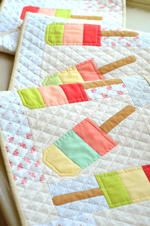 Mini Popsicles Table Runner Quilt Kit includes fabric for the top and the binding.