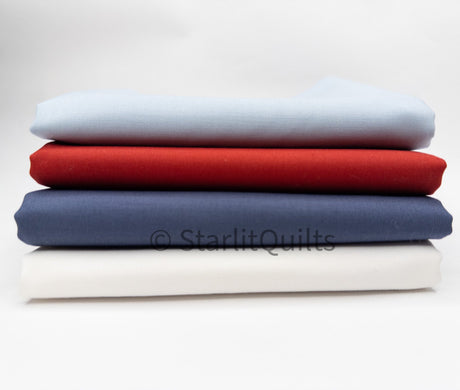 Stack of fabric swatches in blue, red, and white on a light gray background with 'Starlit Quilts' branding.