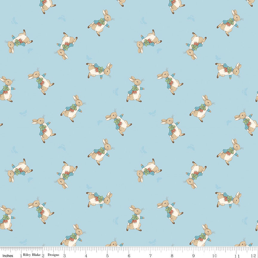 The Tale of Peter Rabbit Blue Peter Toss C14702-Blue Fabrics Sold in 1/2 Yard Increments