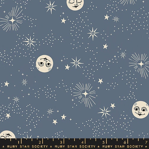 a ruler with stars and moon faces on it