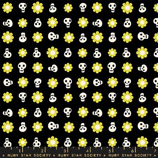 a pattern of skulls and flowers on a black background