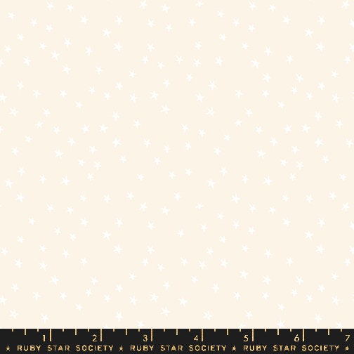 a ruler with a white sheet of paper on top of it