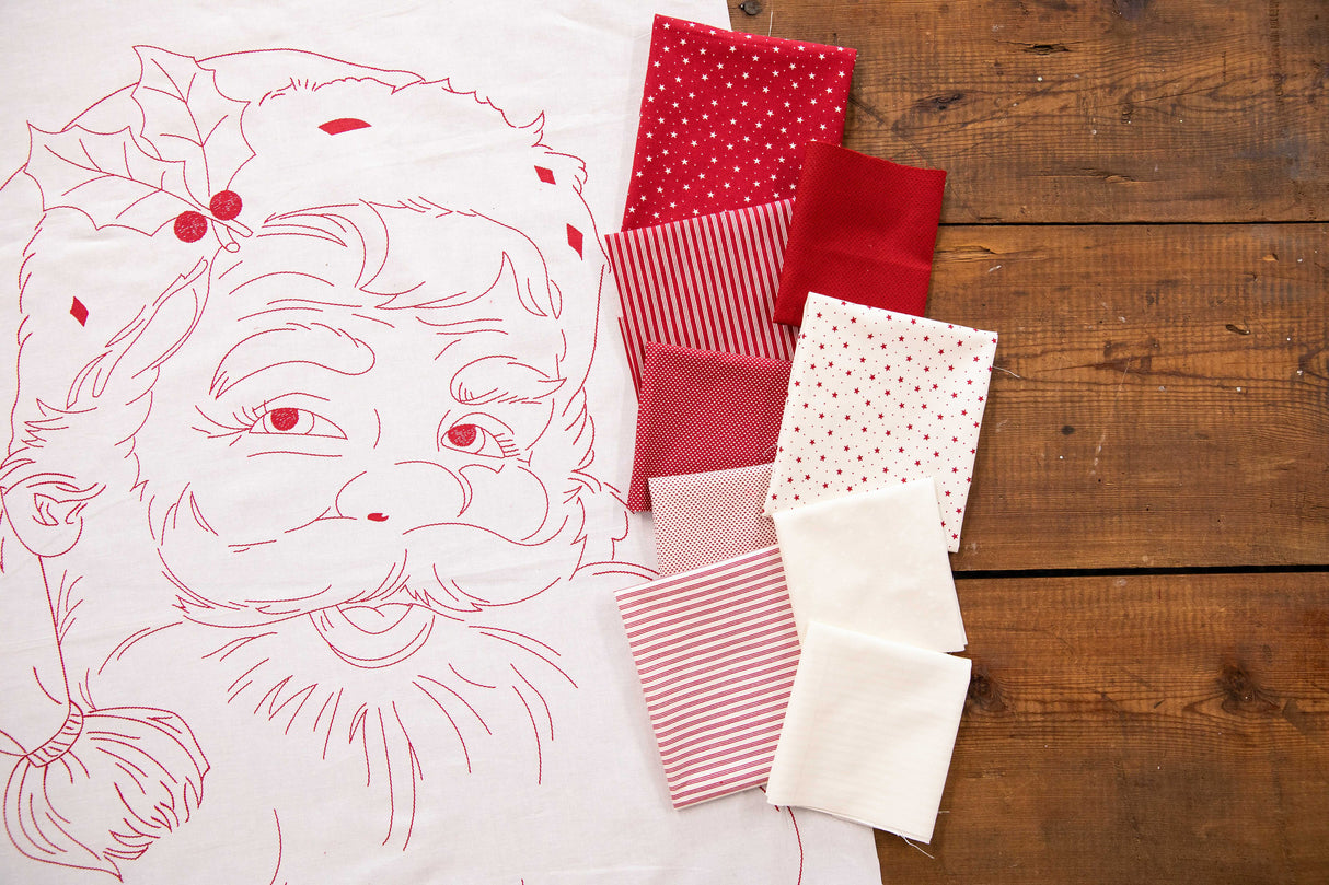 a piece of fabric with a santa face on it