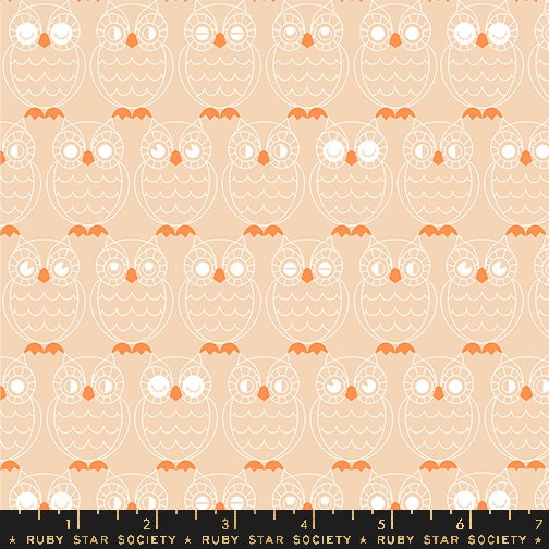 an orange and white owl pattern on a beige background