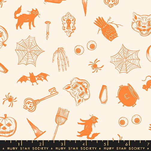 a halloween themed pattern with cats, bats, and pumpkins