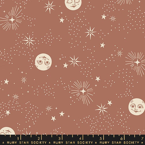 a brown background with stars and moon faces