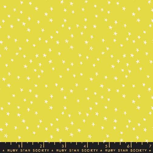 a ruler with a yellow background with white stars