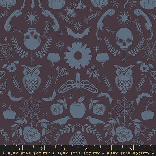 a black and blue pattern with skulls and flowers