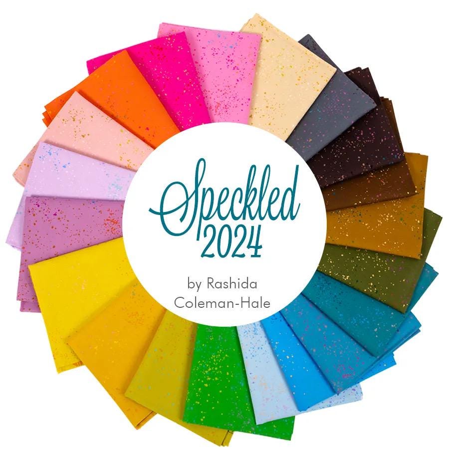 a circle of colored paper with the words speckled 2024 on it