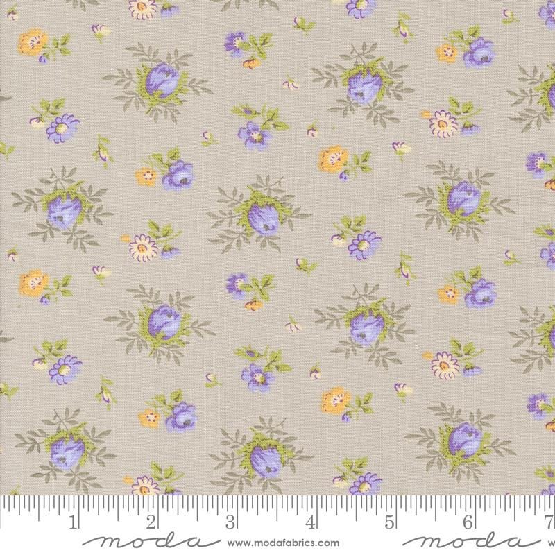 a flowered fabric with blue and yellow flowers on it
