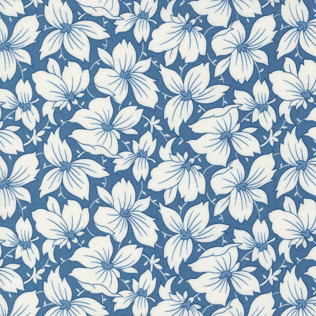 a blue and white flower pattern on a blue background