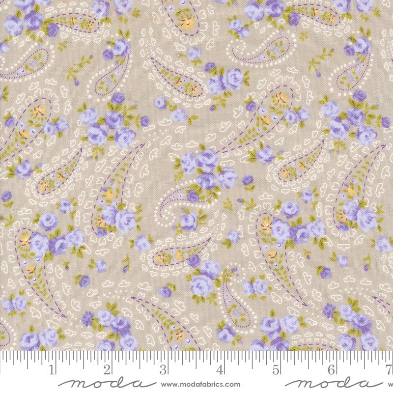 a flowery fabric with purple and yellow flowers