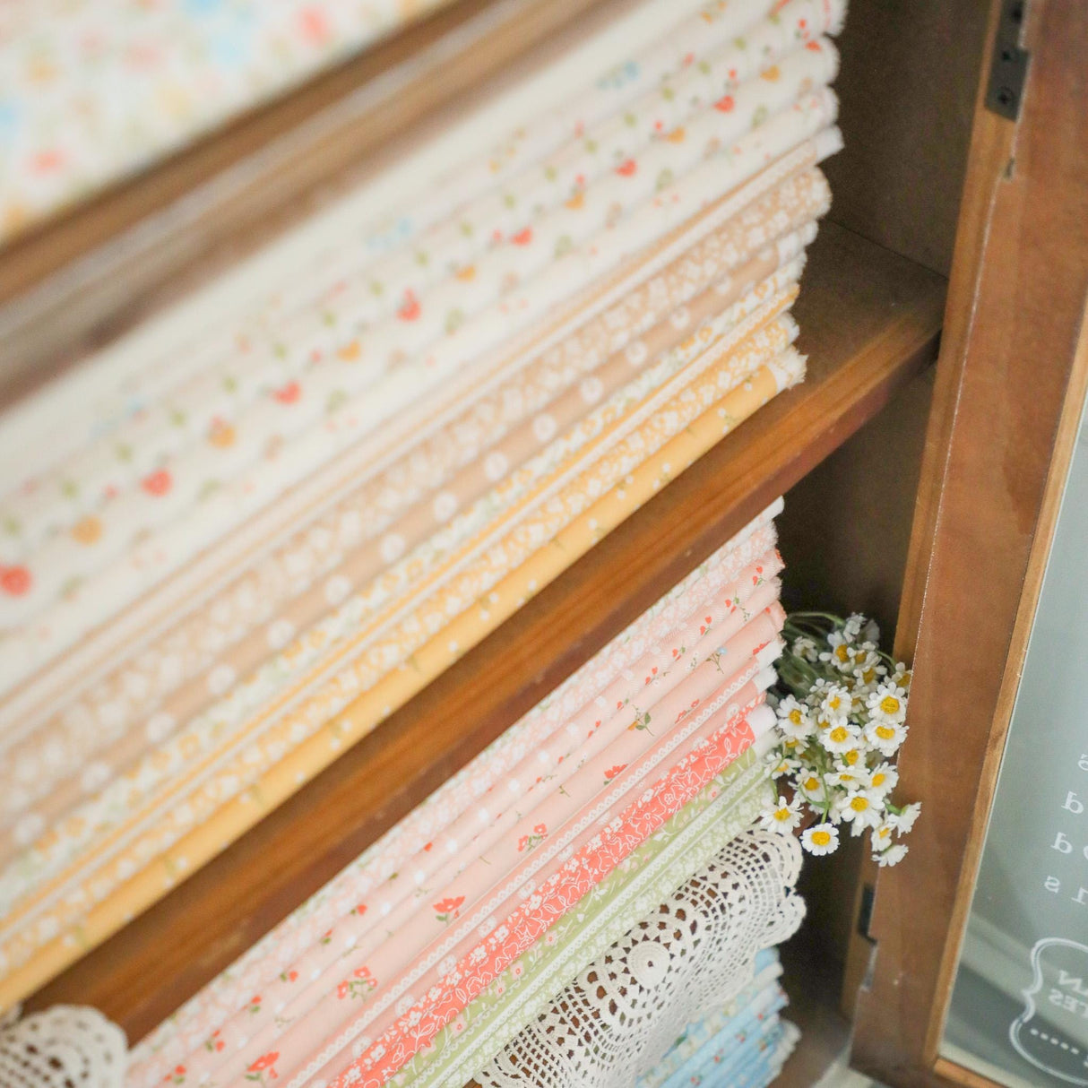 a close up of a shelf with a bunch of fabric on it