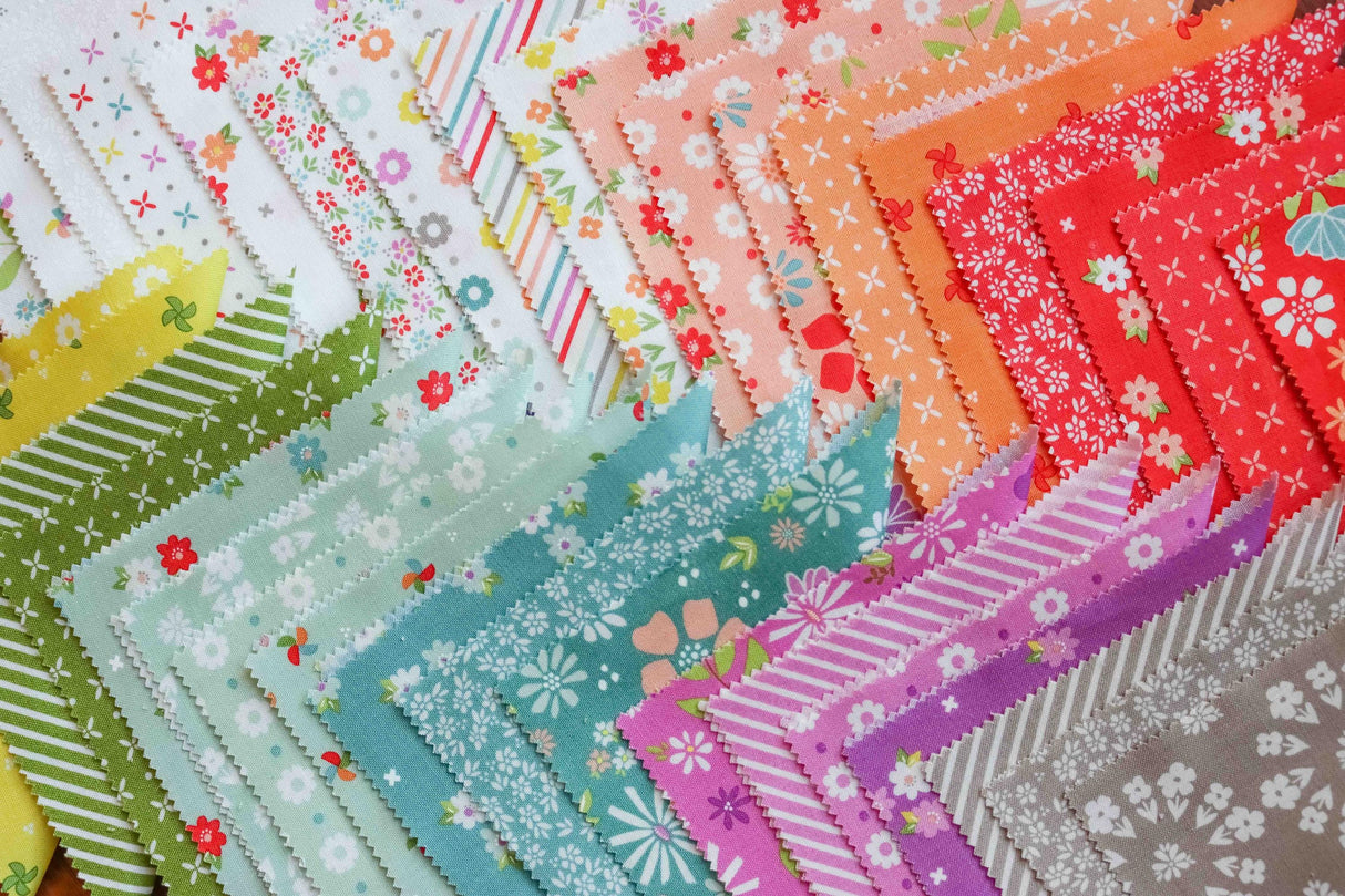 a close up of a quilt with many different colors