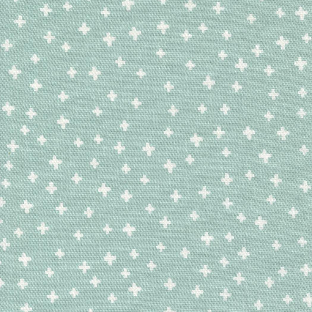 a light blue background with white crosses on it