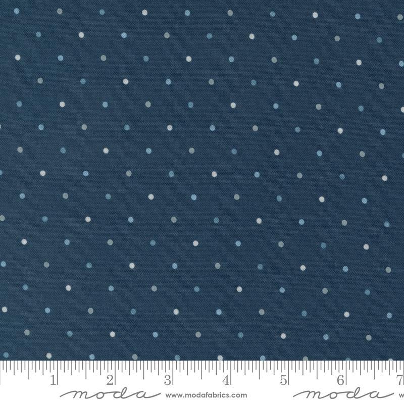 a ruler with a blue background with white polka dots