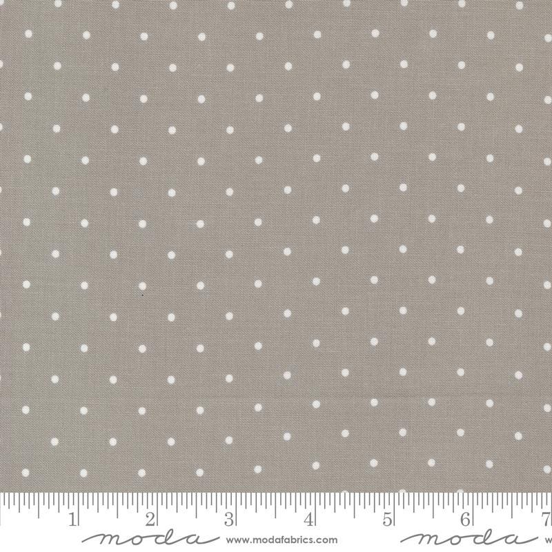 a gray and white polka dot print fabric