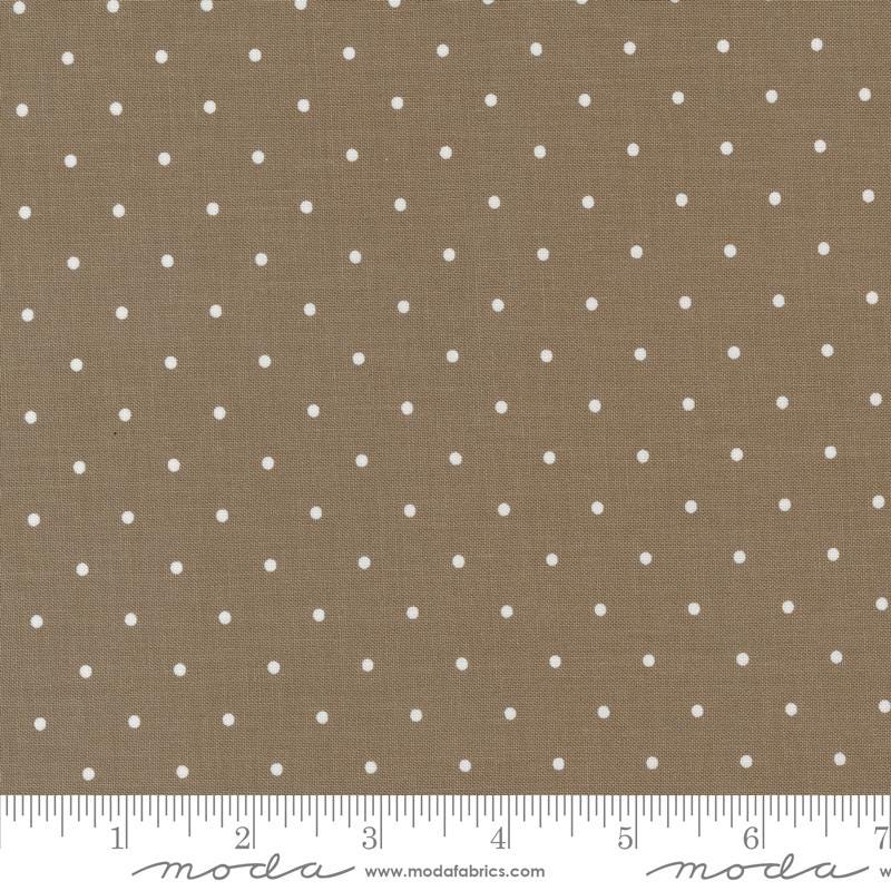 a brown and white polka dot fabric