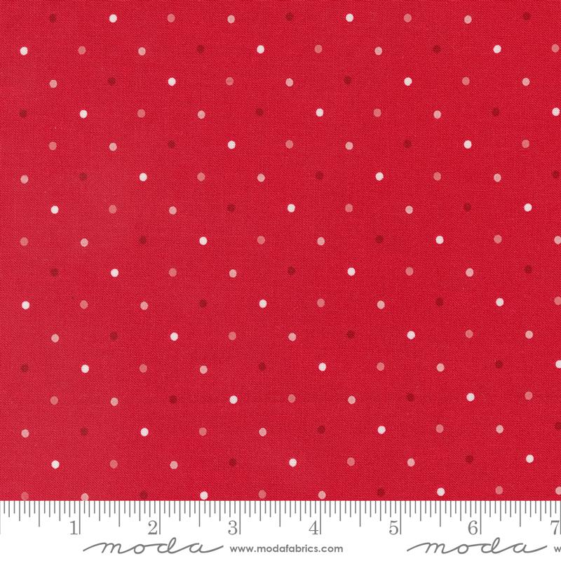 a red background with white polka dots