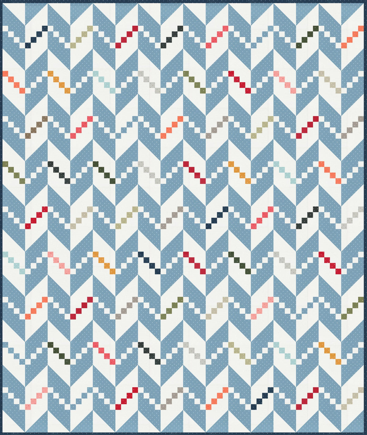 a blue and white quilt with a pattern on it
