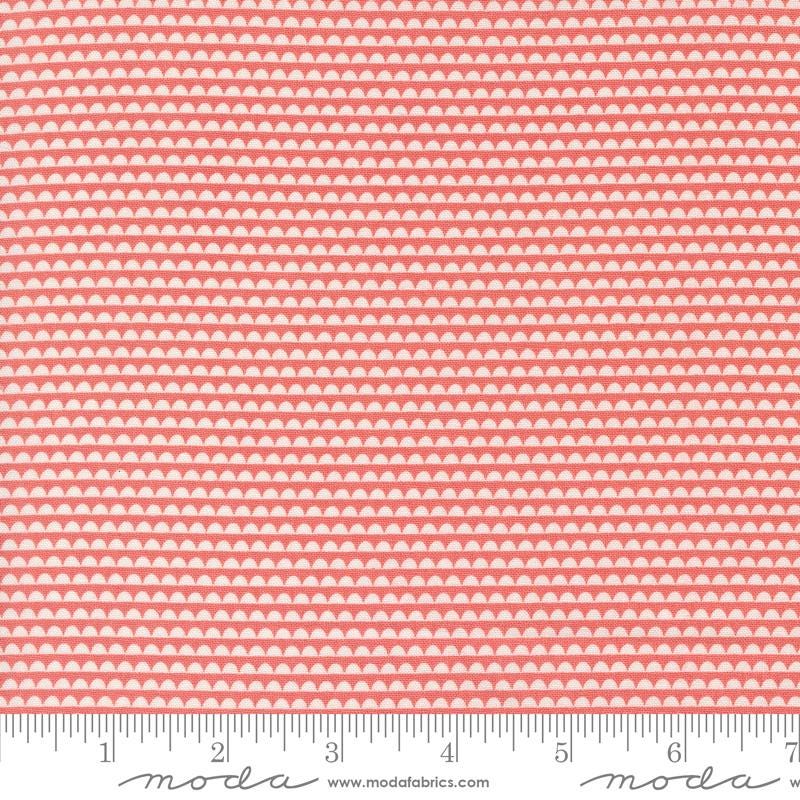 a pink and white background with a ruler