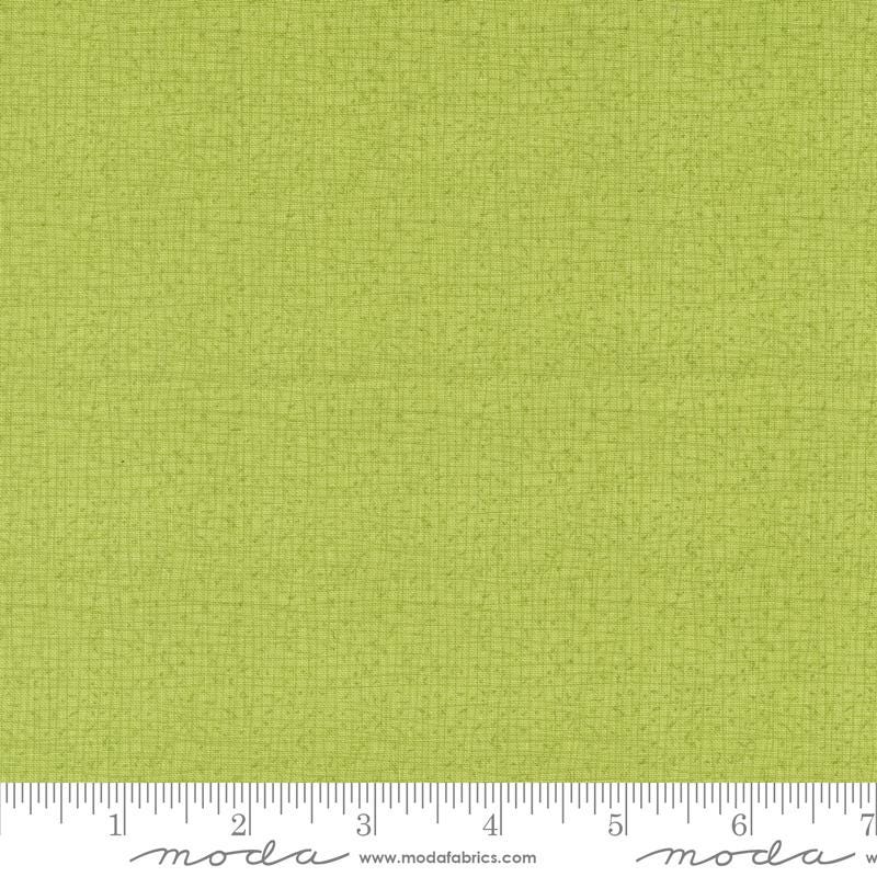 a ruler with a lime green background