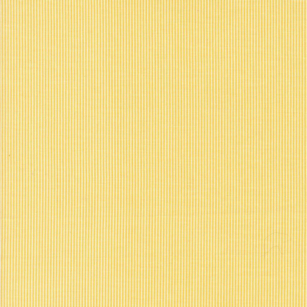 a close up of a yellow fabric texture