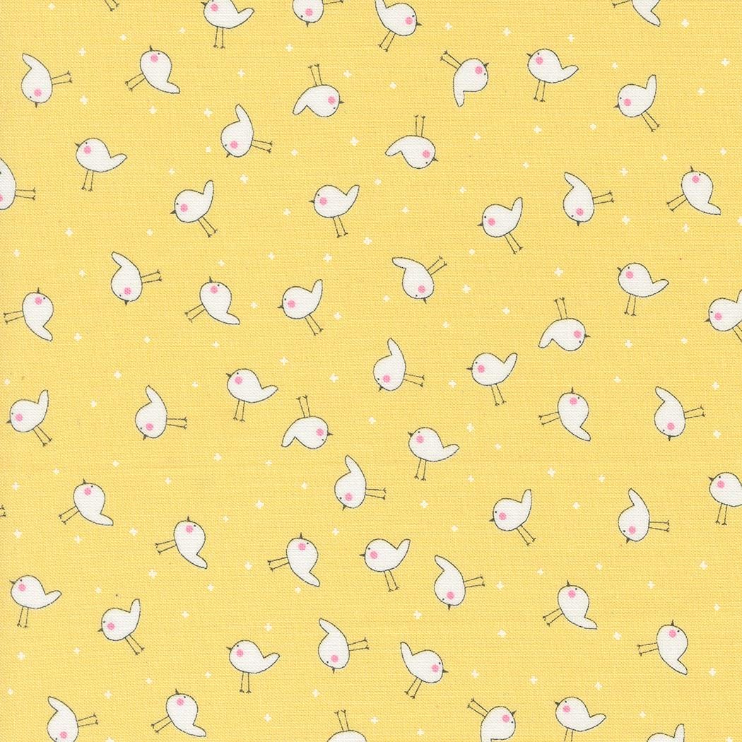 a yellow background with small white birds on it