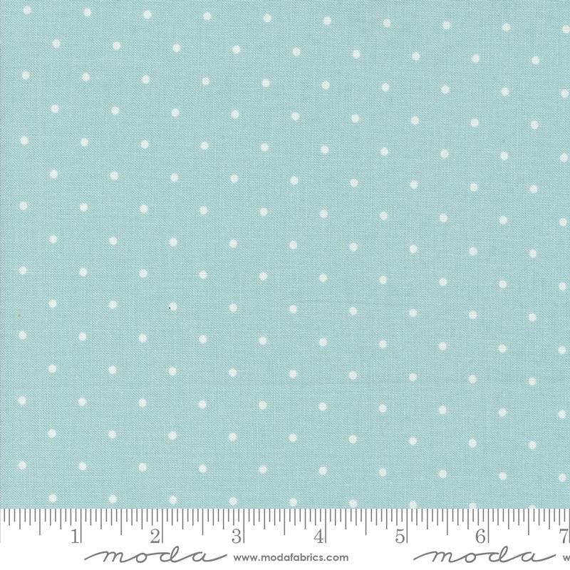 a ruler with a blue background with white polka dots