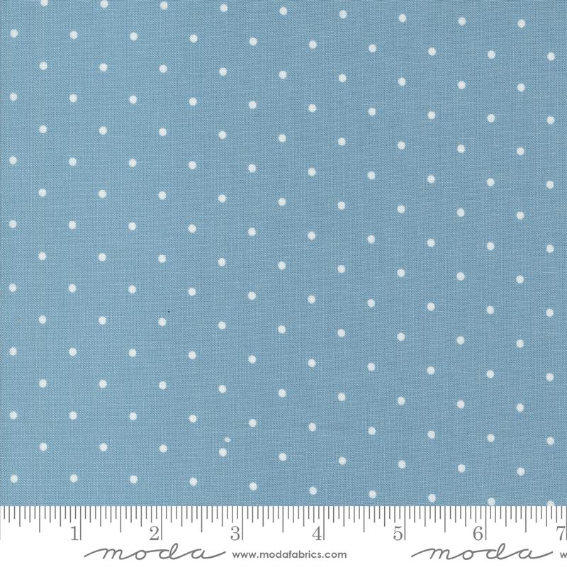 a blue background with white polka dots
