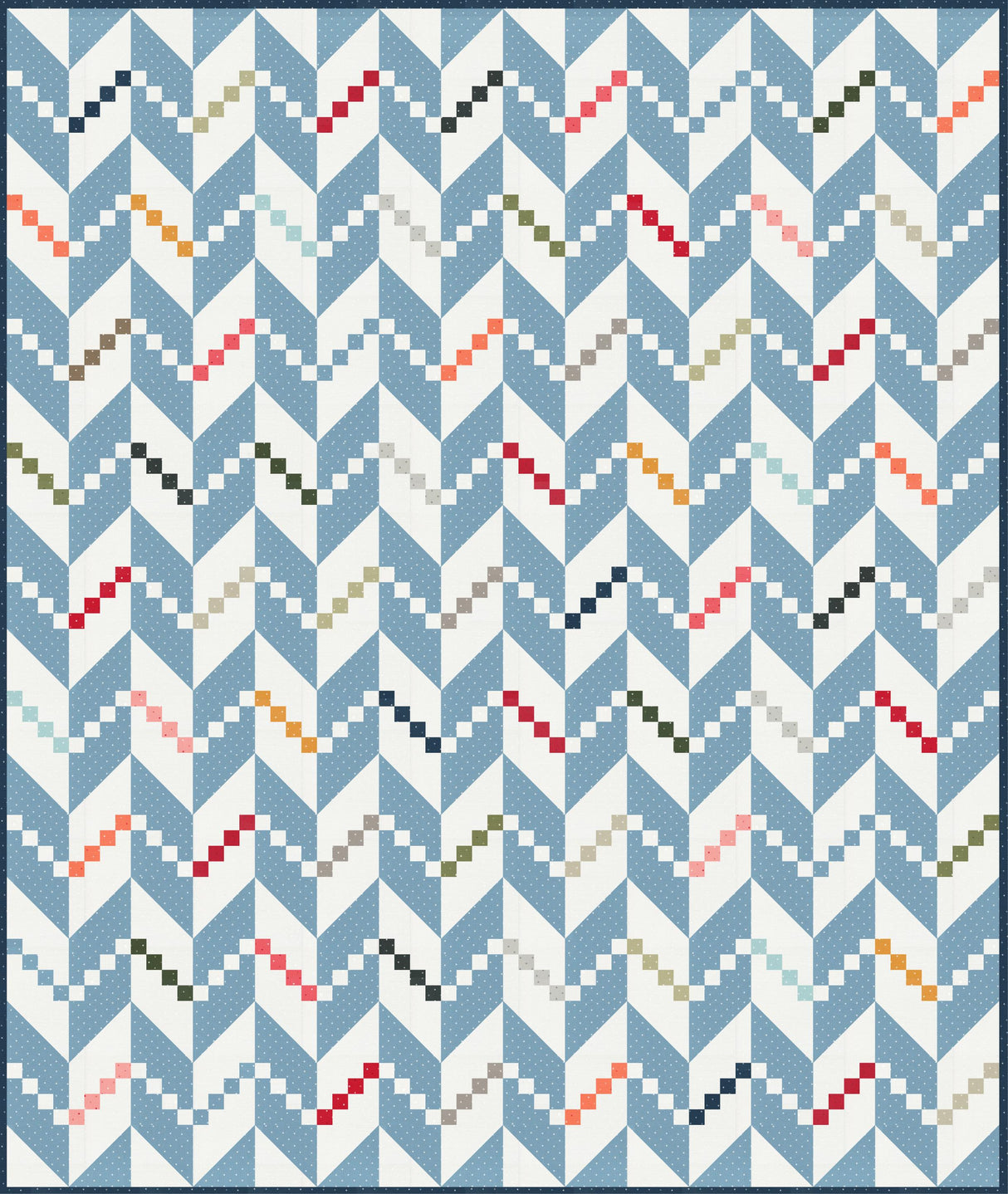 a blue and white quilt with a pattern on it