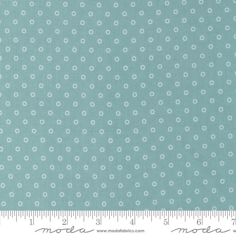 a ruler with a blue background with white circles