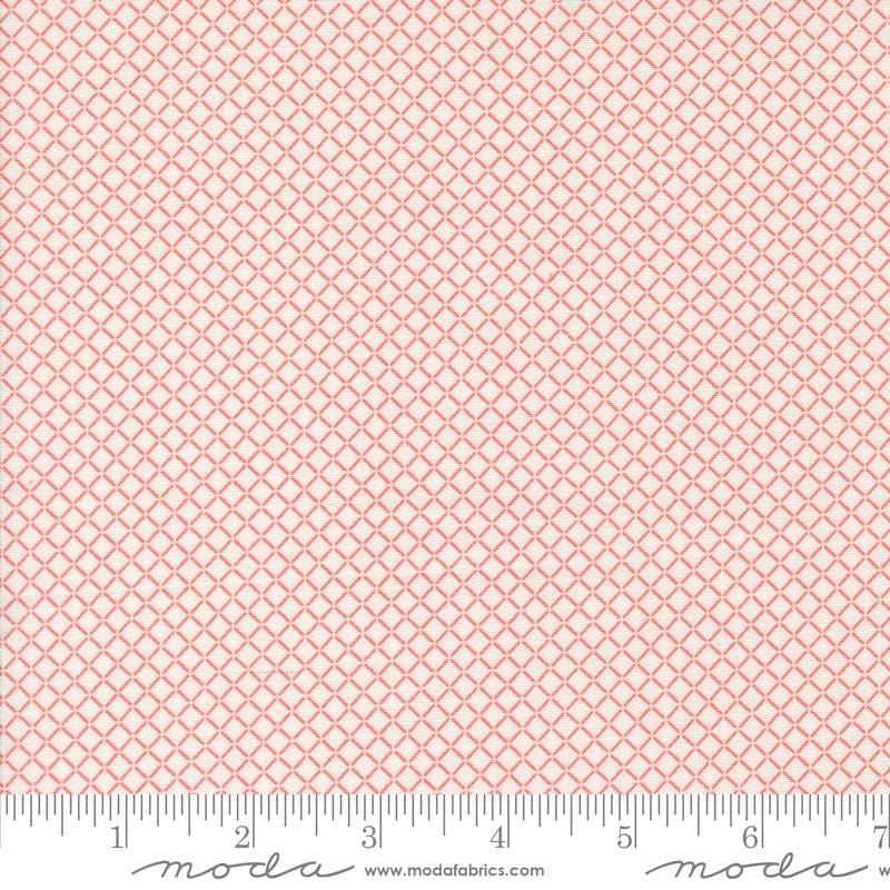 a ruler with a pink and white pattern on it