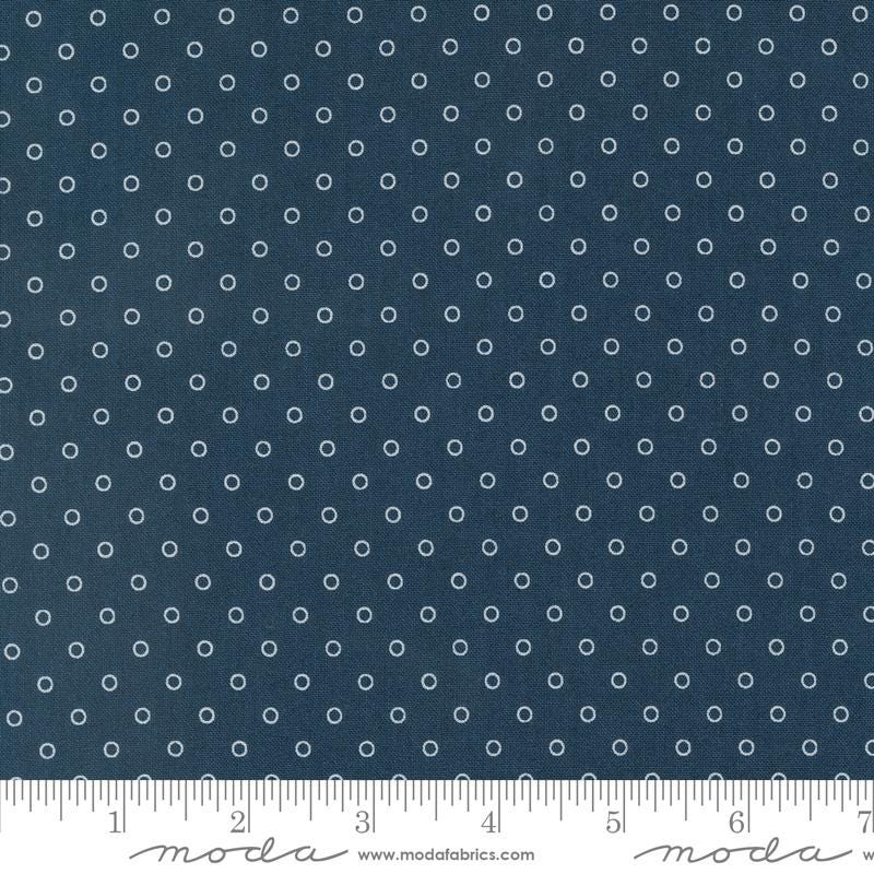 a ruler with a blue background with white circles