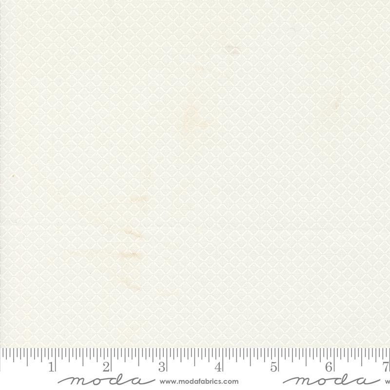 a ruler with a piece of paper on top of it
