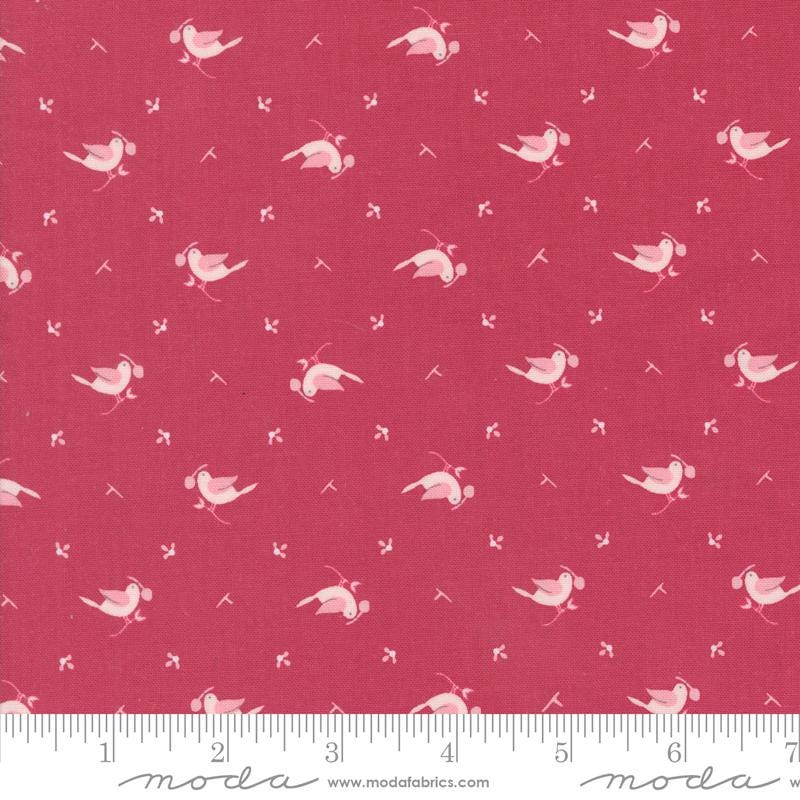 a red fabric with white birds on it