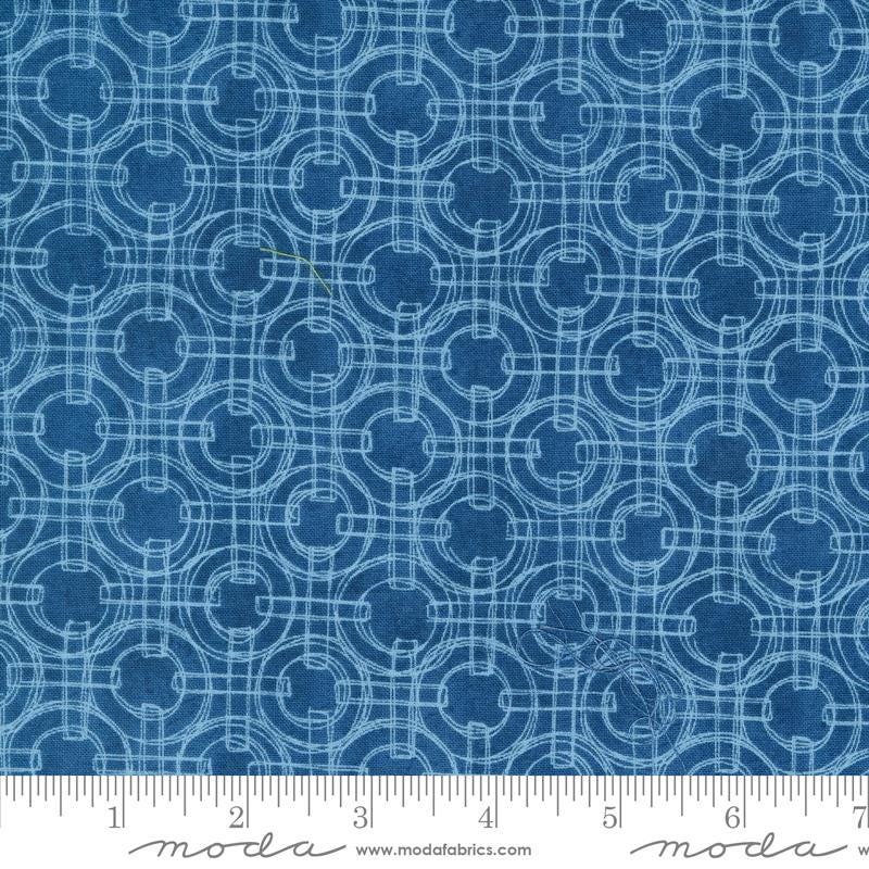 a blue fabric with circles on it
