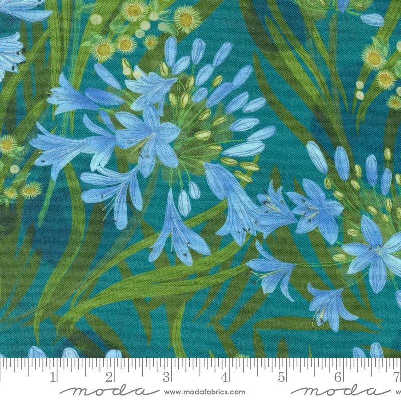 a picture of blue flowers on a green background