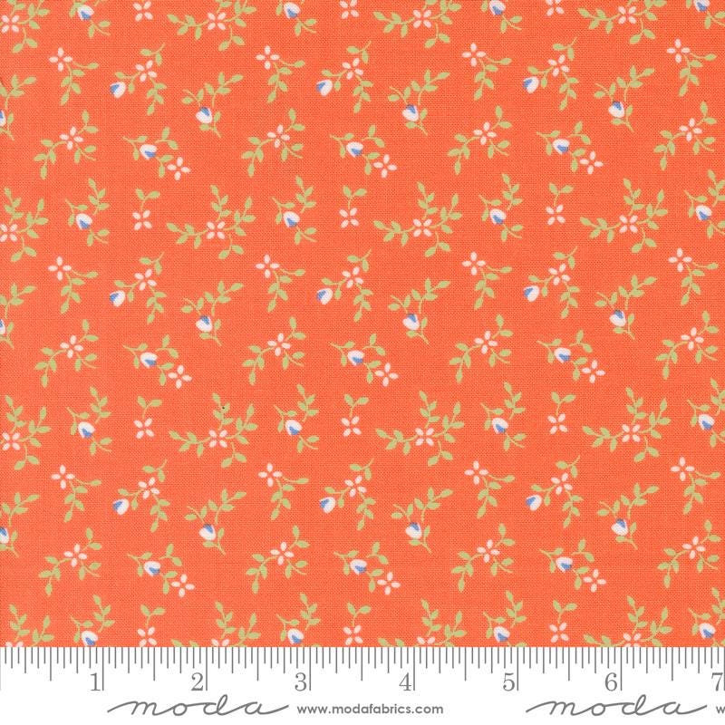 an orange fabric with small flowers on it