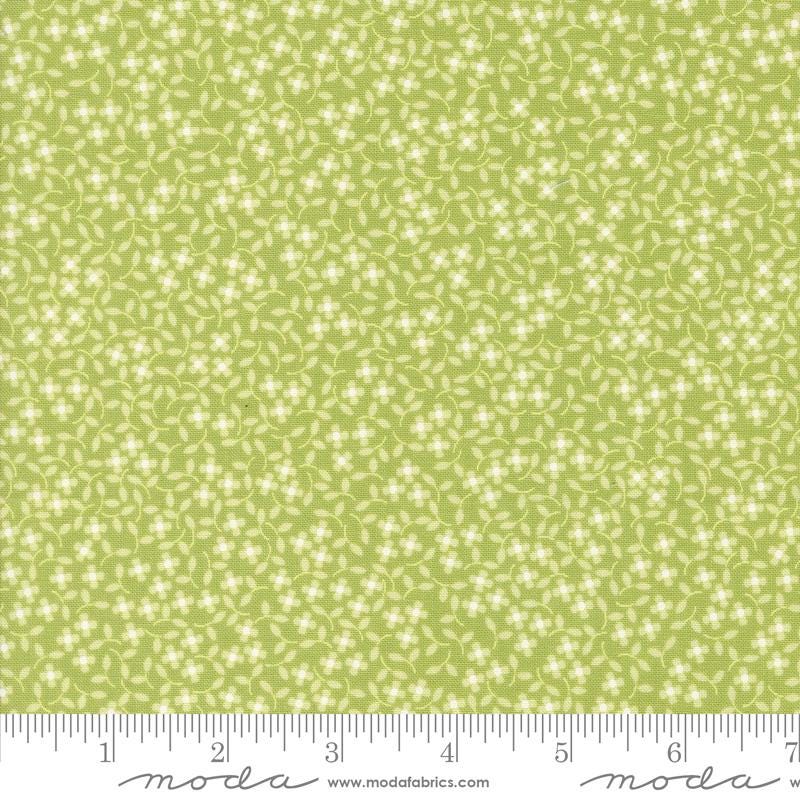 a ruler with a green background with white flowers