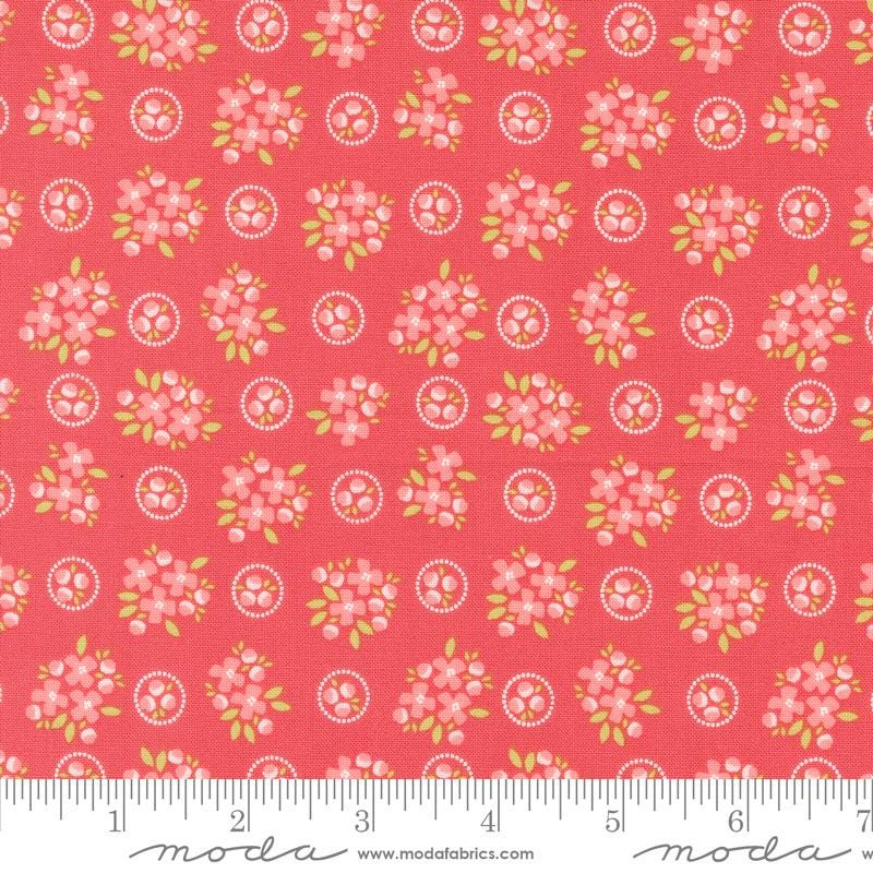 a red background with pink flowers and green leaves