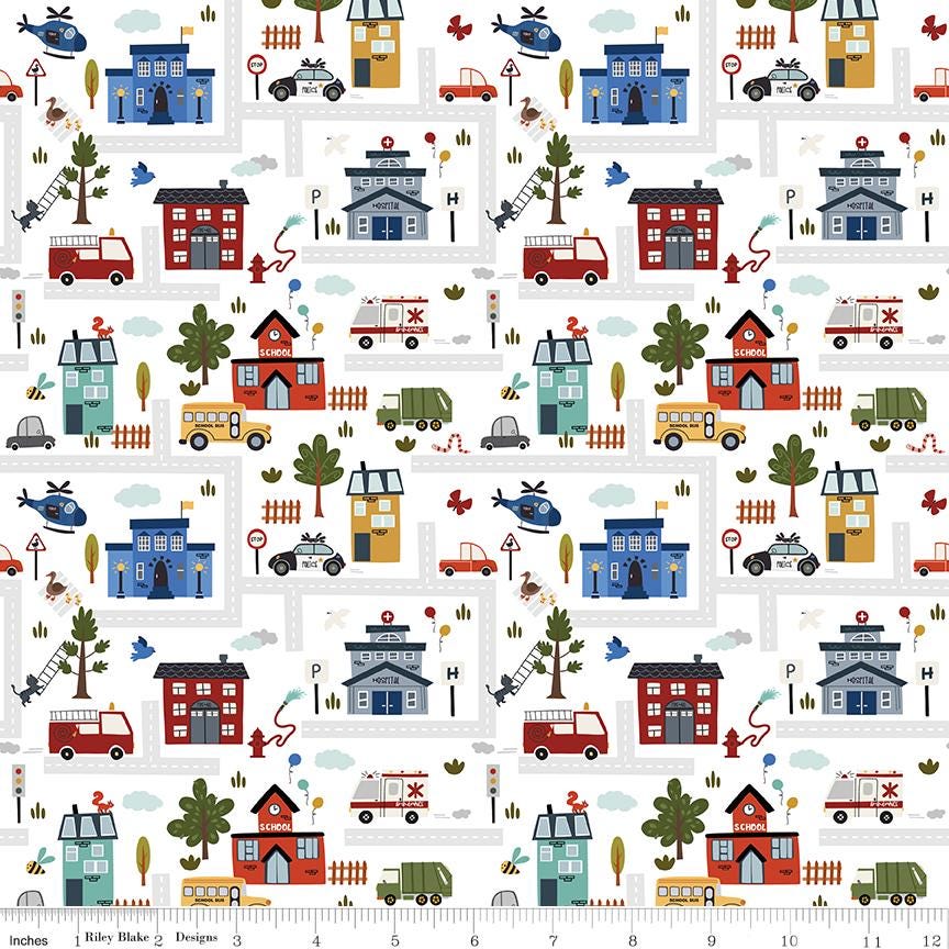a pattern of houses and cars on a white background