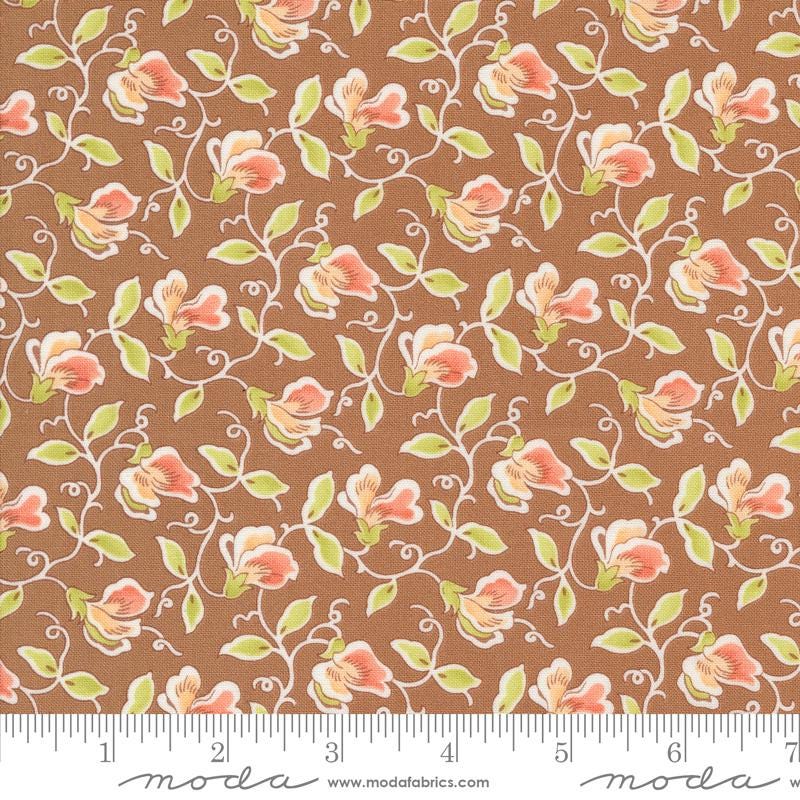 a brown background with pink flowers and green leaves