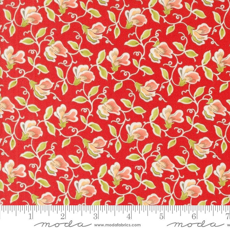 a red background with white flowers and green leaves