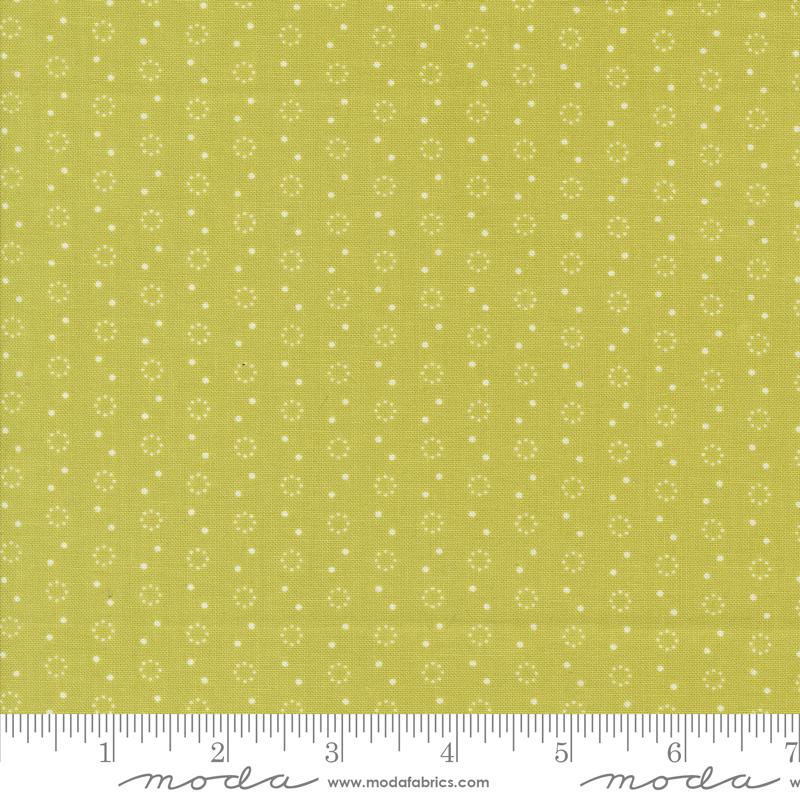 a ruler with a yellow background with white dots