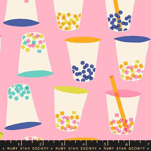 a pink background with cups and a ruler