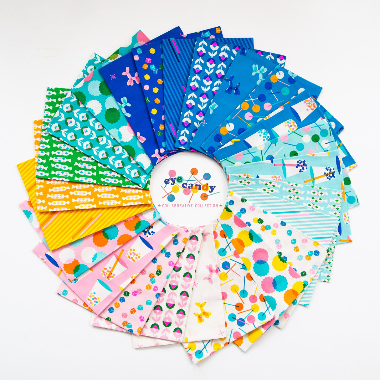 a bunch of different colored papers on a white surface