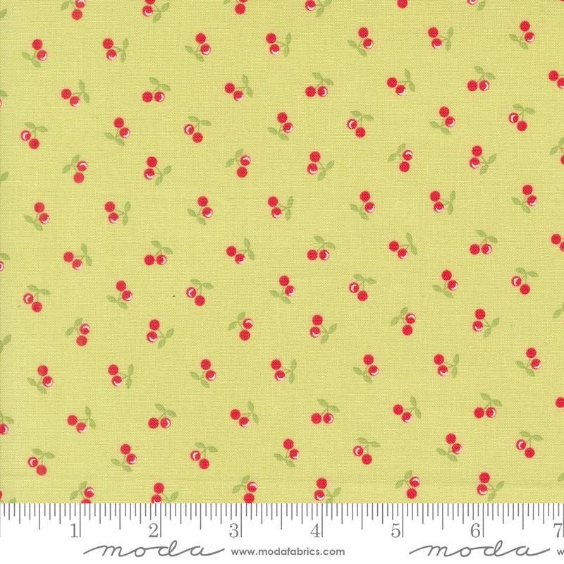 a yellow background with red cherries and green leaves