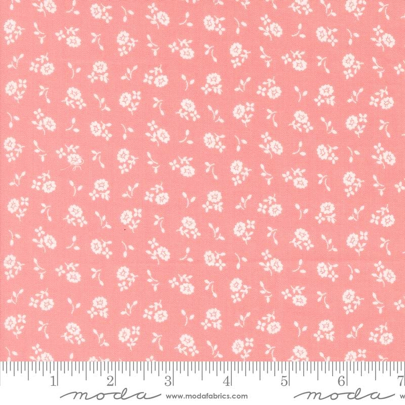 a pink background with white flowers on it