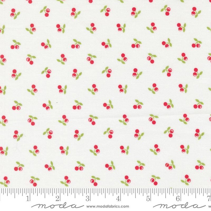 a white background with red cherries and green leaves